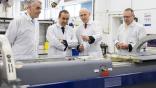 UK government ministers looking at a missile